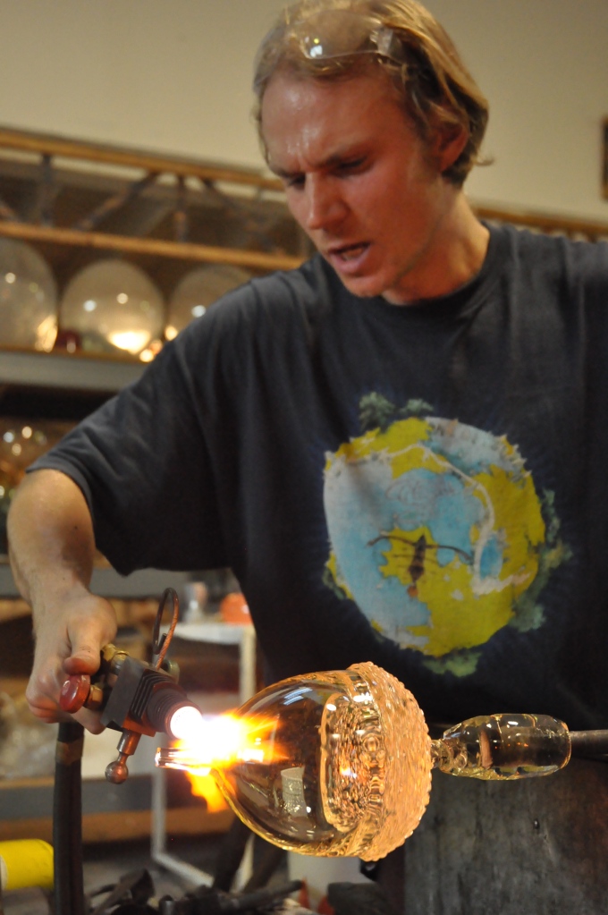 Jason Stropko creating a special order, extra large, blown clear glass acorn.. 